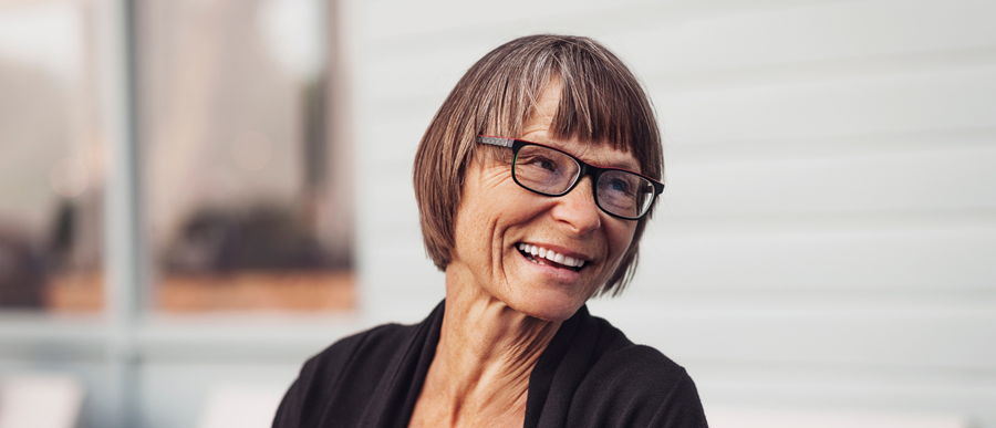 Image of an older woman smiling.]